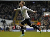 Tottenham Hotspur's Danish midfielder Christian Eriksen celebrates scoring the opening goal of the English Premier League football match between Tottenham Hotspur and West Bromwich Albion at White Hart Lane in north London on December 26, 2013