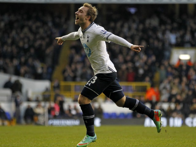 Tottenham Hotspur's Danish midfielder Christian Eriksen celebrates scoring the opening goal of the English Premier League football match between Tottenham Hotspur and West Bromwich Albion at White Hart Lane in north London on December 26, 2013