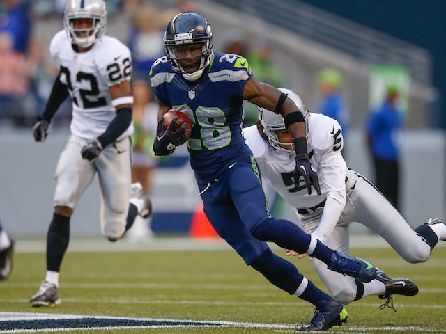  Punt returner Walter Thurmond of the Seattle Seahawks rushes against the Oakland Raiders at CenturyLink Field on August 29, 2013