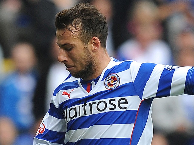 Adam Le Fondre of Reading attacks during the Sky Bet Championship match between Reading v Watford at The Madejski Stadium on August 17, 2013