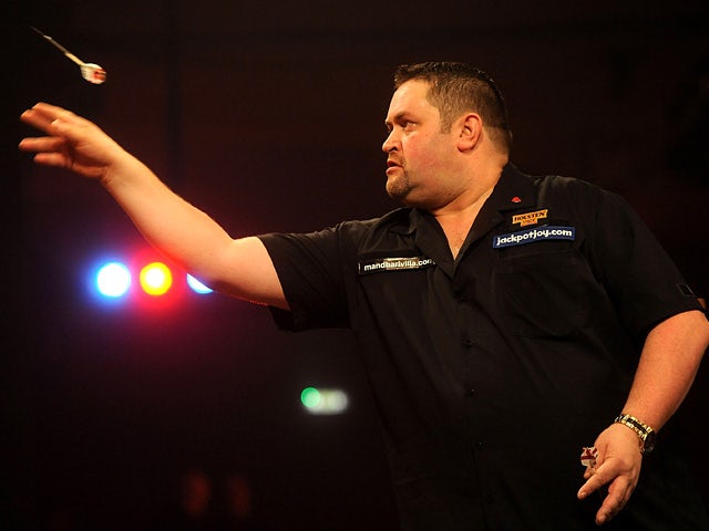 Alan Norris in action against Scott Waites during day one of the BDO Lakeside World Professional Darts Championships on January 4, 2013
