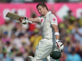 Australian batsman Steve Smith raises his bat after reaching his century on the first day of the fifth Ashes cricket Test against England at the Sydney Cricket Ground on January 3, 2014