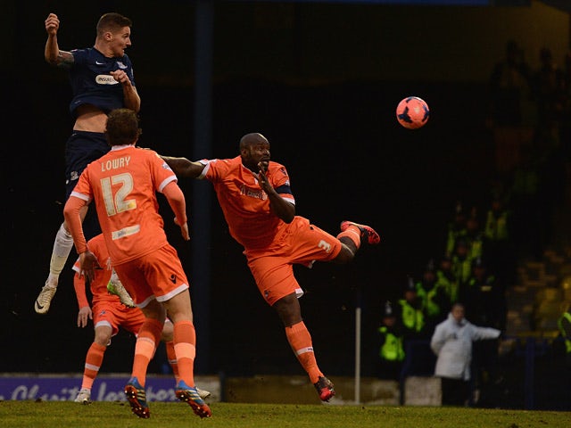 Southend's Barry Corr heads in the opening goal against Millwall during their FA Cup third round match on January 4, 2013