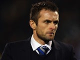 Brighton & Hove Albion Interim Manager Nathan Jones looks on prior to the Sky Bet Championship match between Fulham and Brighton & Hove Albion at Craven Cottage on December 29, 2014 