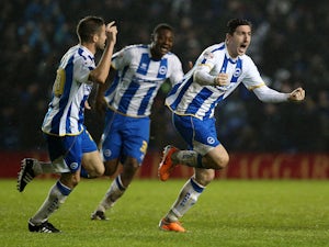 Stephen Ward of Brighton celebrates scoring a late equaliser with team mate Matthew Upson during the Sky Bet Championship match between Brighton & Hove Albion and AFC Bournemouh at The Amex Stadium on January 01, 2014