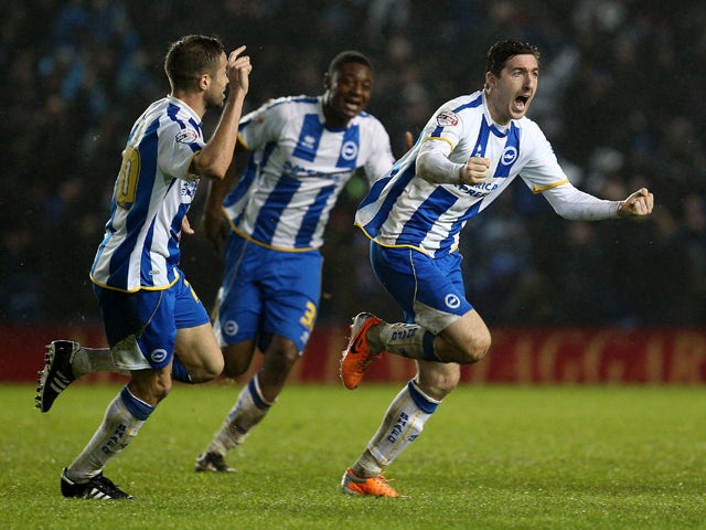 Stephen Ward of Brighton celebrates scoring a late equaliser with team mate Matthew Upson during the Sky Bet Championship match between Brighton & Hove Albion and AFC Bournemouh at The Amex Stadium on January 01, 2014
