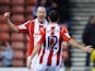 Stoke's Charlie Adam celebrates with teammate Marc Wilson after scoring his team's second goal against Leicester during their FA Cup third round match on January 4, 2013