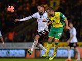 Fulham's Clint Dempsey and Norwich's David Fox battle for the ball during their FA Cup third round match on January 4, 2013