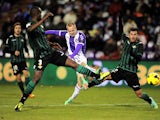 Real Betis' Daniel Larsson takes a shot past the Valladolid defence during their La Liga match on January 4, 2013
