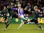Real Betis' Daniel Larsson takes a shot past the Valladolid defence during their La Liga match on January 4, 2013