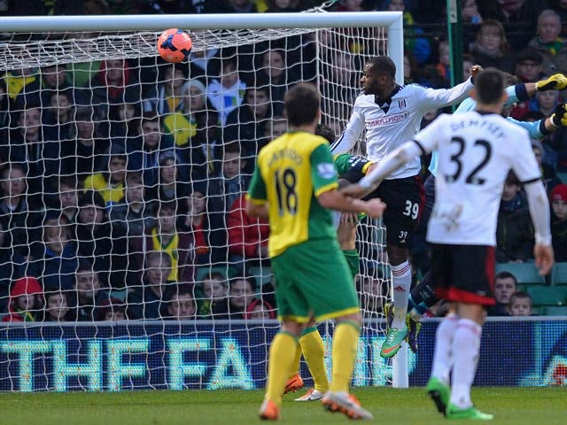 Fulham's Darren Bent scores the opening goal against Norwich during their FA Cup third round match on January 4, 2013