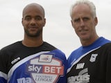 David McGoldrick of Ipswich Town holds his Player of the Month award for September next to manager Mick McCarthy