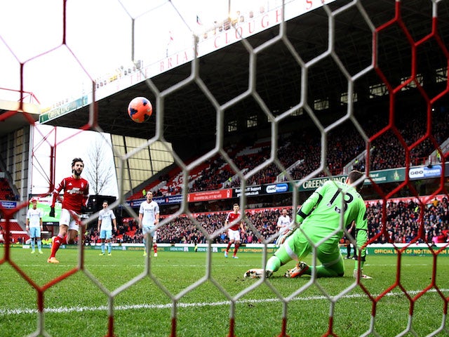 Djamel Abdoun of Nottingham Forest chips a penalty kick past goalkeeper Adrian of West Ham United to score their first goal during the FA Cup Third Round tie on January 5, 2014