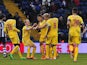 Crystal Palace's Dwight Gayle is congratulated by teammates after scoring the opening goal against West Brom during their FA Cup third round match on January 4, 2013