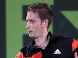 Germany's Florian Mayer returns the ball to Romania's Victor Hanescu during their quarter-finals tennis match in Qatar's ExxonMobil Open in Doha on January 2, 2014