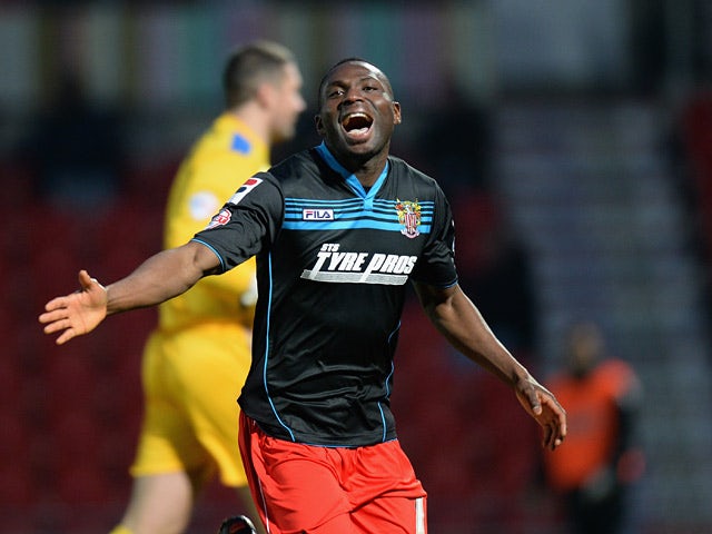 Stevenage's Francois Zoko celebrates after scoring the opening goal against Doncaster during their FA Cup third round match on January 4, 2013