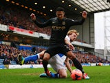 Manchester City's Gael Clichy and Blackburn's Chris Taylor in action during their FA Cup third round match on January 4, 2013