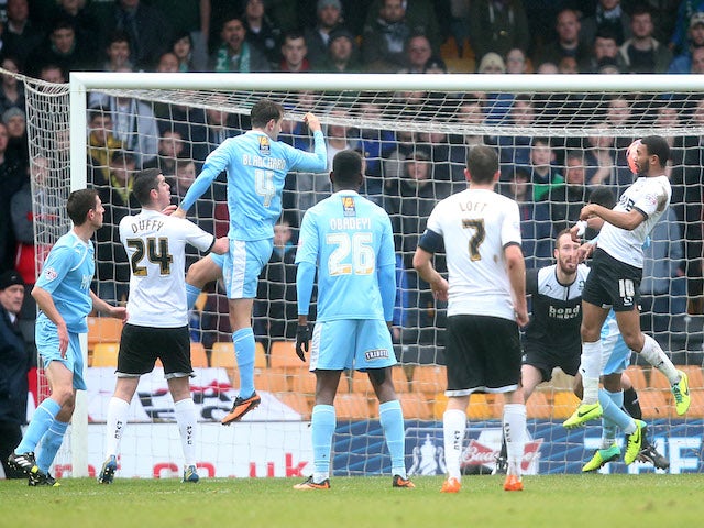 Gavin Tomlin of Port Vale scores the opening goal during the Budweiser FA Cup third round match between Port Vale and Plymouth Argyle at Vale Park on January 5, 2014