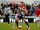 Newcastle's Hatem Ben Arfa and Cardiff's Aron Gunnarsson in action during their FA Cup third round match on January 4, 2013