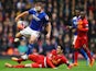 James Wesolowski of Oldham is tackled by Luis Alberto of Liverpool during the Budweiser FA Cup third round match on January 5, 2014
