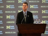 Jim Harbaugh speaks as he is introduced as the new Head Coach of the University of Michigan football team at the Junge Family Champions Center on December 30, 2014