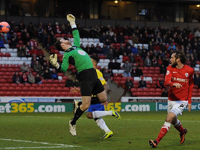 Barnsley's Jim O'Brien scores the opening goal against Coventry during their FA Cup third round match on January 4, 2013