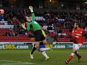 Barnsley's Jim O'Brien scores the opening goal against Coventry during their FA Cup third round match on January 4, 2013