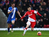 Kidderminster's Joe Lolley and Peterborough's Shaun Brisley in action during their FA Cup third round match on January 4, 2013