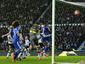 John Obi Mikel of Chelsea heads the ball to score their first goal during the Budweiser FA Cup Third Round match against Derby County on January 5, 2014