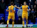 Preston's Kevin Davies celebrates with teammate Lee Holmes after scoring his team's opening goal against Ipswich during their FA Cup third round match on January 4, 2013