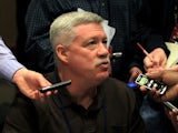 Offensive coordinator Kevin Gilbride of the New York Giants answers questions from the press during a media availability session for Super Bowl XLVI at the Indianapolis Downtown Marriott on February 2, 2012