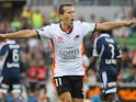 Brisbane Roar's Liam Miller celebrates after scoring the opening goal against Melbourne Victory during their A-League match on January 4, 2013