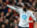 Emmanuel Adebayor of Tottenham Hotspur celebrates scoring the opening goal during the Barclays Premier League match between Manchester United and Tottenham Hotspur at Old Trafford on January 1, 2014
