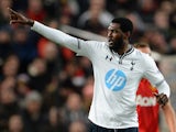 Emmanuel Adebayor of Tottenham Hotspur celebrates scoring the opening goal during the Barclays Premier League match between Manchester United and Tottenham Hotspur at Old Trafford on January 1, 2014