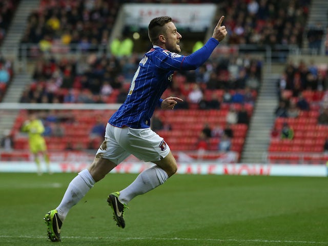 Carlisle United's English midfielder Matty Robson celebrates after scoring a goal during the English FA Cup third round football match against Sunderland on January 5, 2014