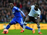 Michael Essien of Chelsea and Simon Dawkins of Derby battle for the ball during the Budweiser FA Cup Third Round match on January 5, 2014