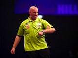 Michael van Gerwen of Holland celebrates winning a leg during his third round match against Terry Jenkins of England during the William Hill PDC World Darts Championships on Day Nine at Alexandra Palace on December 29, 2014