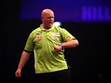 Michael van Gerwen of Holland celebrates winning a leg during his third round match against Terry Jenkins of England during the William Hill PDC World Darts Championships on Day Nine at Alexandra Palace on December 29, 2014
