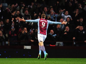 Aston Villa's Nicklas Helenius celebrates after scoring his team's first goal against Sheffield United during their FA Cup third round match on January 4, 2013