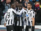 Newcastle's Papiss Cisse is congratulated by teammates after scoring the opening goal against Cardiff during their FA Cup third round match on January 4, 2013