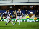 Matt Phillips of Queens Park Rangers scores 1st goal as he's challenged by Ross Turnbull of Doncaster Rovers during the Sky Bet Championship match between Queens Park Rangers and Doncaster Rovers at Loftus Road on January 1, 2014
