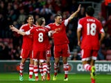 Southampton's Rickie Lambert celebrates with teammates after scoring his team's second goal against Burnley during their FA Cup third round match on January 4, 2013