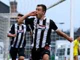 Grimsby's Ross Hannah celebrates after scoring the opening goal against Huddersfield during their FA Cup third round match on January 4, 2013