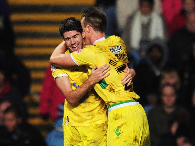 Sheffield United's Ryan Flynn celebrates with teammate Tony McMahon after scoring his team's second goal during their FA Cup third round match on January 4, 2013
