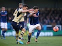 Rochdale's Scott Hogan and Leeds' Jason Pearce battle for the ball during their FA Cup third round match on January 4, 2013