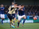 Rochdale's Scott Hogan and Leeds' Jason Pearce battle for the ball during their FA Cup third round match on January 4, 2013