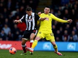 Grimsby's Scott Neilson and Huddersfield's Adam Hammill in action during their FA Cup third round match on January 4, 2013