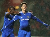 Oscar of Chelsea celebrates with teammate Ramires after scoring his team's third goal during the Barclays Premier League match between Southampton and Chelsea at St Mary's Stadium on January 1, 2014