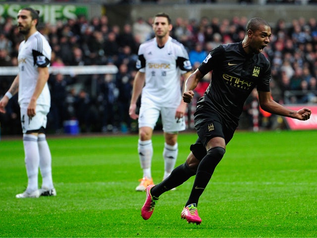 Manchester City player Fernandinho celebrates the opening goal during the Barclays Premier League match between Swansea City and Manchester City at Liberty Stadium on January 1, 2014