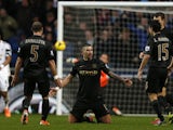 Manchester City's Serbian defender Aleksandar Kolarov celebrates with teammates after scoring their third goal during the English Premier League football match between Swansea City and Manchester City at The Liberty Stadium in Swansea, south Wales on Janu